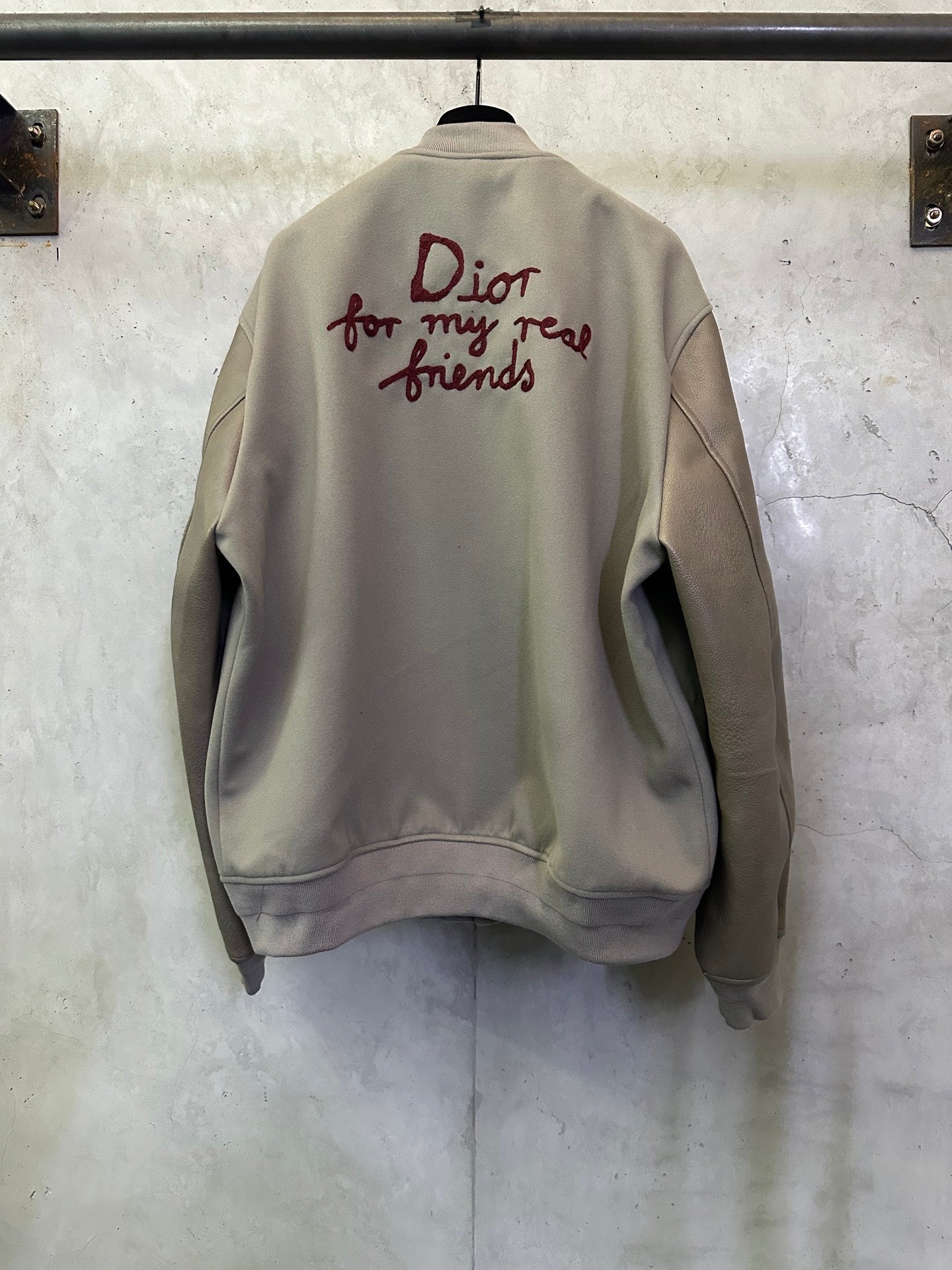 Olive jacket back with burgundy “Dior for my real friends” script graphic