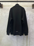 Black long-sleeve hoodie, back view, with small logo near hem.