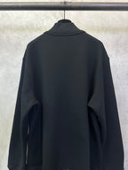 Black long-sleeve hoodie with stand collar and plain back.