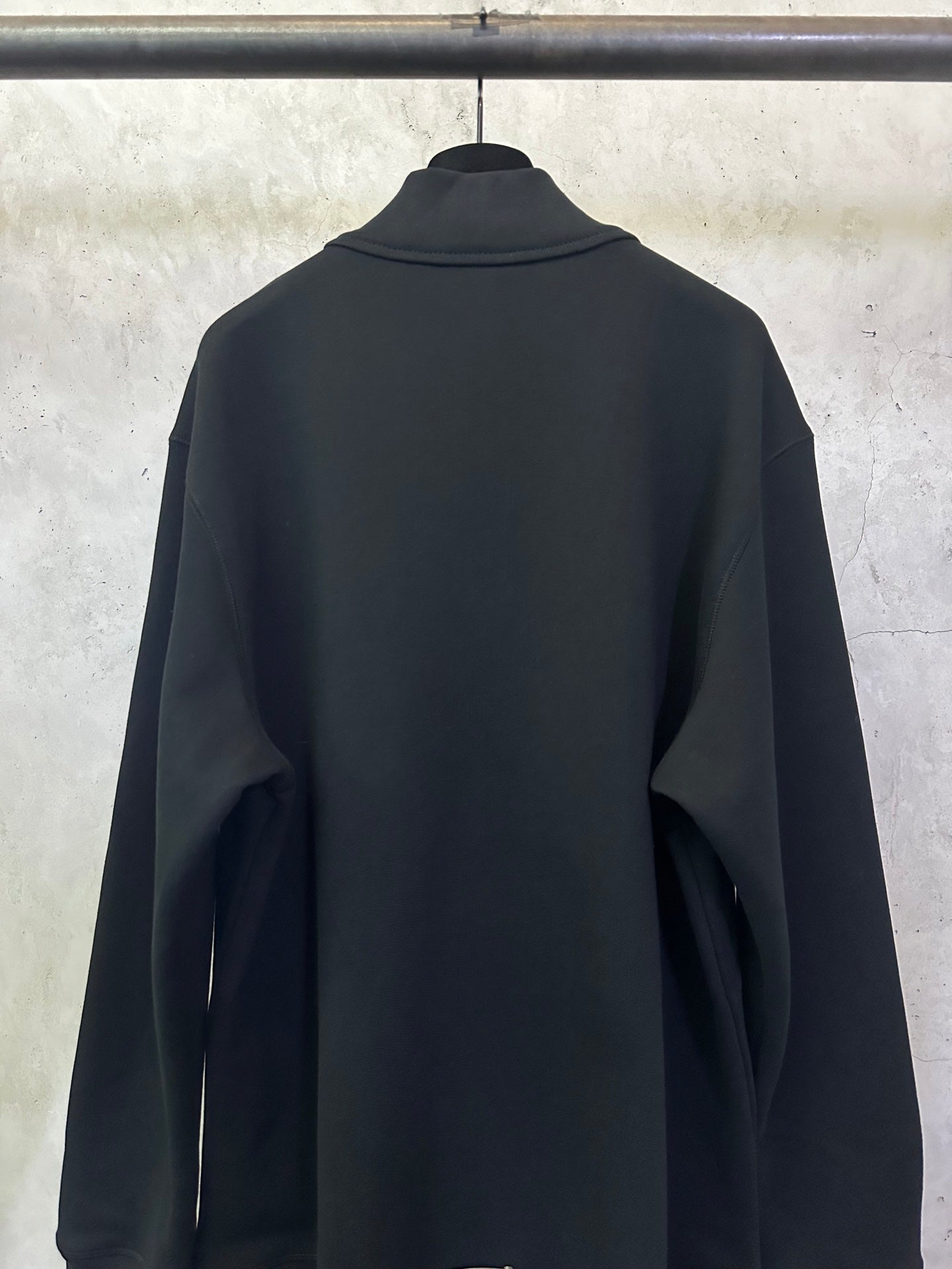 Black long-sleeve hoodie with stand collar and plain back.