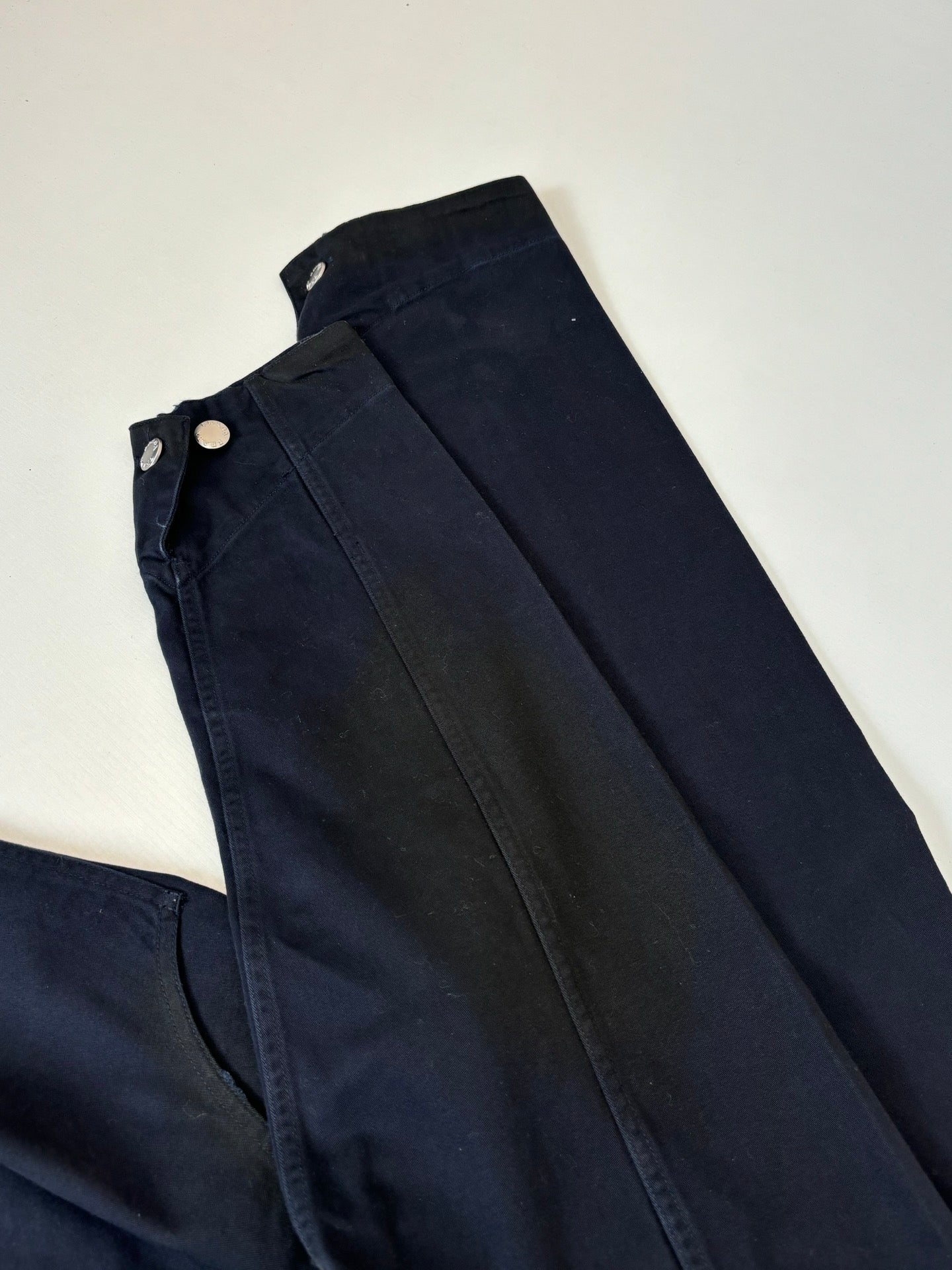 Navy long bottoms with buttoned waistband and pleated front panels