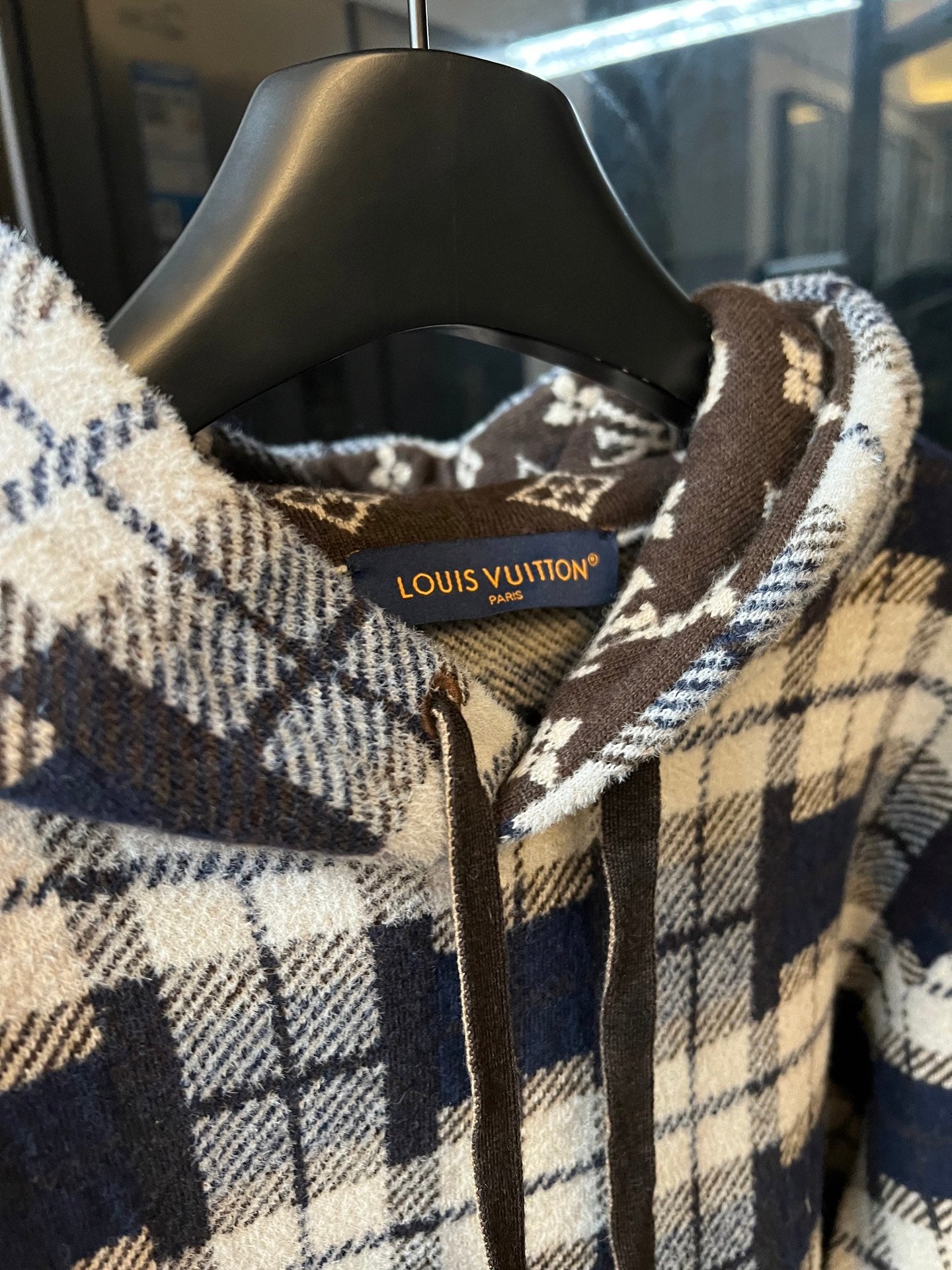 Hooded sweatshirt neckline with printed Louis Vuitton label inside and plaid fabric