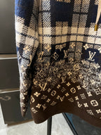 Brown monogram panel on long-sleeve hoodie with cream-and-navy plaid upper