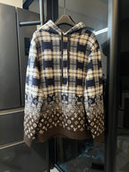 Long-sleeve hooded sweatshirt with cream and navy plaid top and brown monogram hem