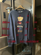 Navy knit sweater with teddy bear and American flag design with ribbed cuffs