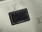 Beige textured bag with black leather logo patch and white stitching