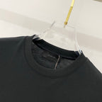Black crewneck T-shirt neckline with inner Amiri tag detail
