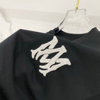 Black T-shirt with large white logo graphic on shoulder