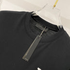 Black crewneck T-shirt neckline with inner Amiri label