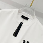 White Amiri T-shirt neckline with black size tag label