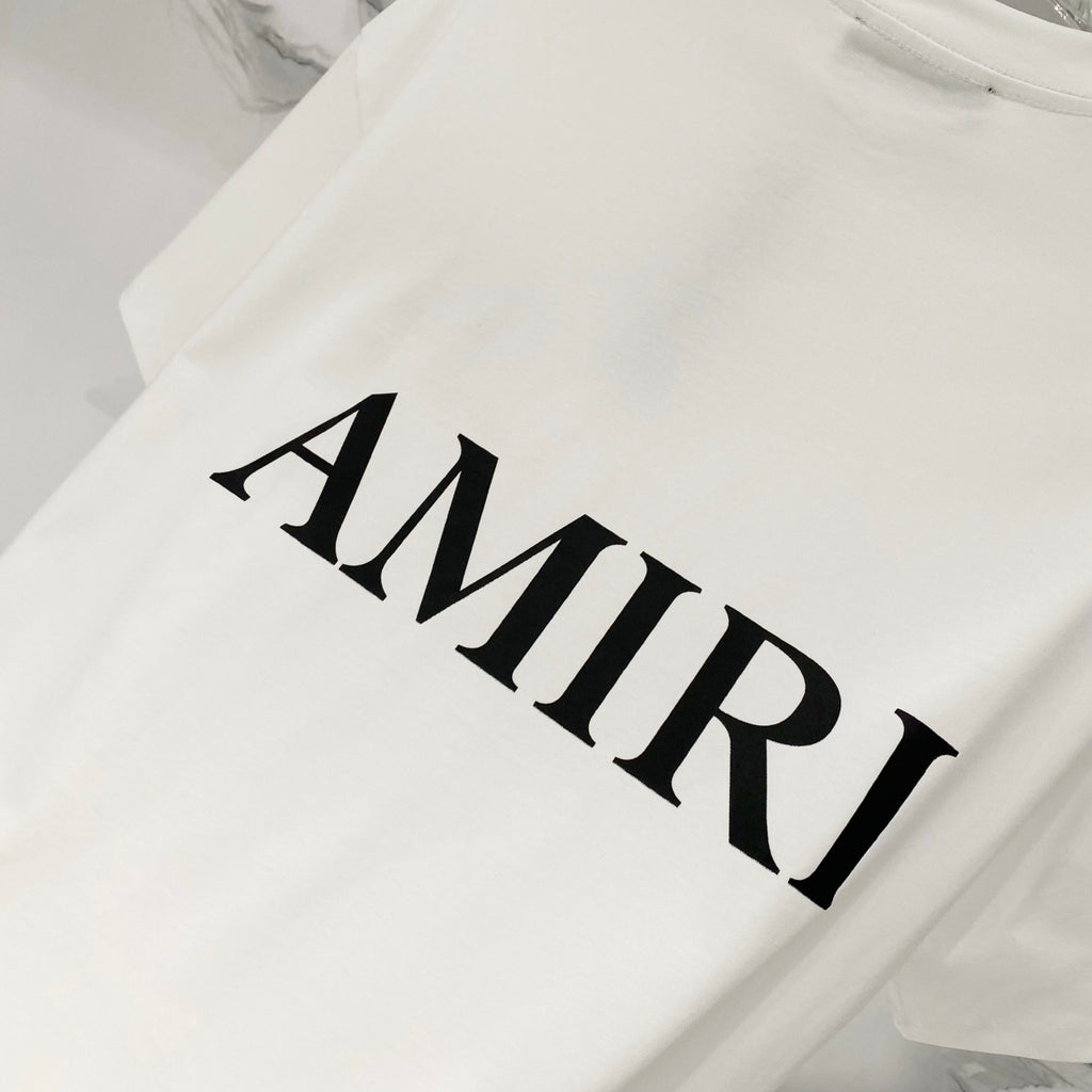 White Amiri T-shirt close-up of black AMIRI wordmark