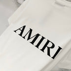 White Amiri T-shirt close-up of black AMIRI wordmark
