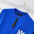 Blue crewneck T-shirt on hanger, with white monogram detail at chest