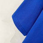 Blue T-shirt sleeve cuff and hem stitching detail
