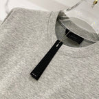Amiri heather gray crewneck T-shirt neckline close-up with black brand tag