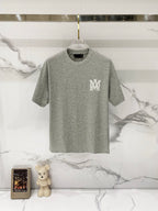 Amiri crewneck T-shirt in heather gray with small white MM logo on left chest