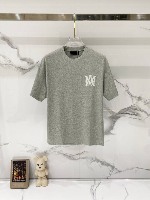 Amiri crewneck T-shirt in heather gray with small white MM logo on left chest