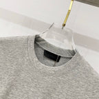 Amiri heather gray crewneck T-shirt with inner black brand label at collar