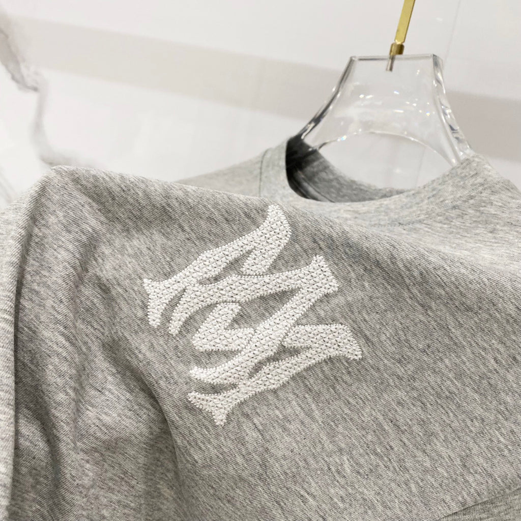 Amiri heather gray crewneck T-shirt with white graphic motif on front