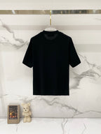 Black crew-neck T-shirt on hanger, short sleeves