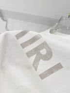 White crewneck T-shirt with large AMIRI lettering graphic