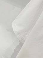 White crewneck T-shirt fabric close-up with stitched collar