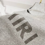 Amiri heather gray T-shirt with AMIRI logo detail on chest