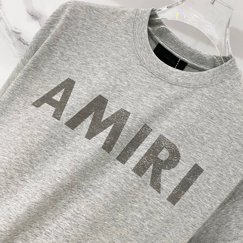 Amiri T-shirt in heather gray with large AMIRI logo across chest