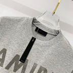 Amiri crew-neck T-shirt in heather gray with black size label at neckline