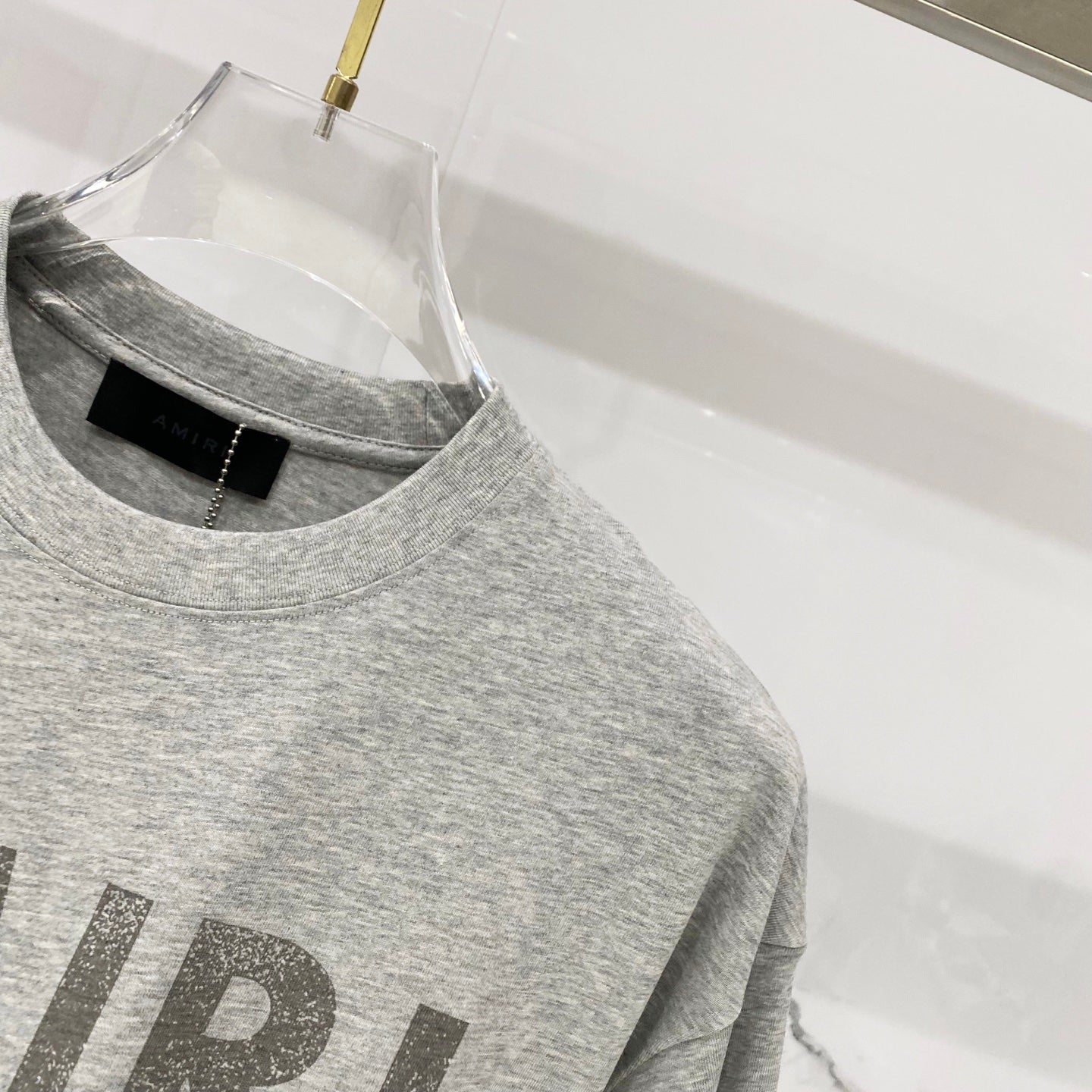 Amiri heather gray T-shirt with crew neckline and visible side seam