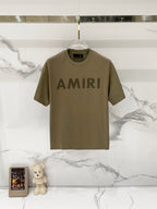Olive T-shirt with AMIRI logo graphic on front, crew neck and short sleeves
