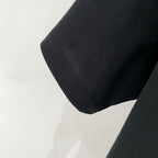 Black Amiri T-shirt sleeve cuff and hem stitching close-up