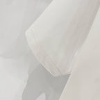 White T-shirt showing side seam and hem stitching detail.