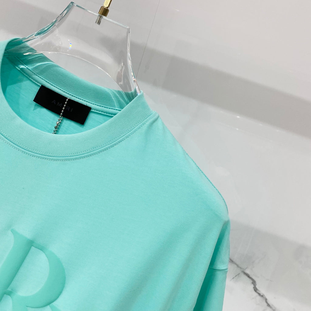 Turquoise crewneck T-shirt neckline and shoulder seam