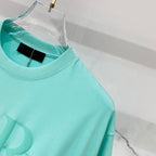 Turquoise crewneck T-shirt neckline and shoulder seam