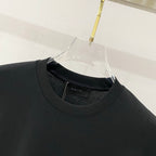 Black crewneck T-shirt collar with inner AMIRI branding label