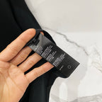 Black T-shirt size label tag with care text