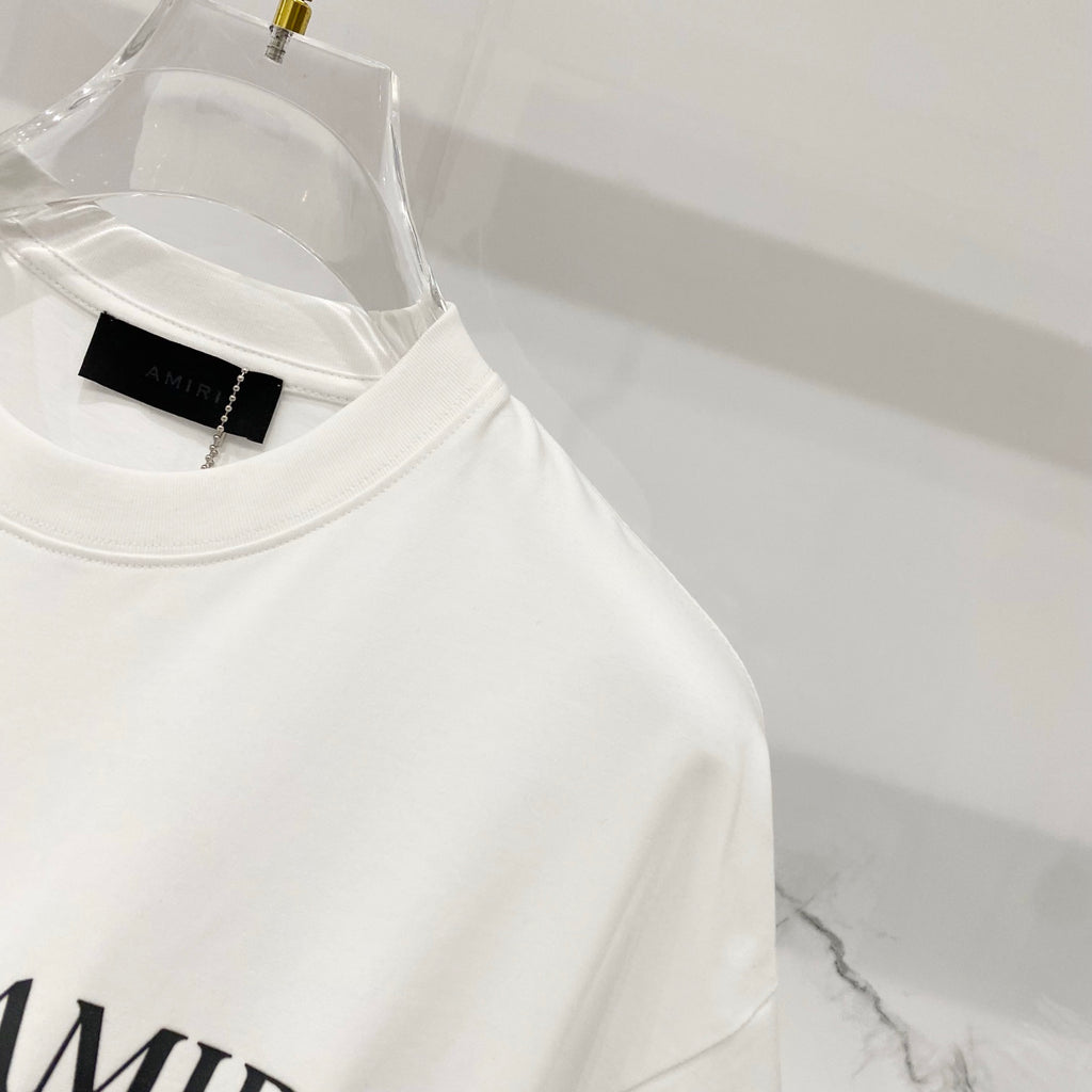 Amiri white T-shirt close-up of crew collar with black branded neck label