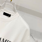 Amiri white T-shirt close-up of crew collar with black branded neck label