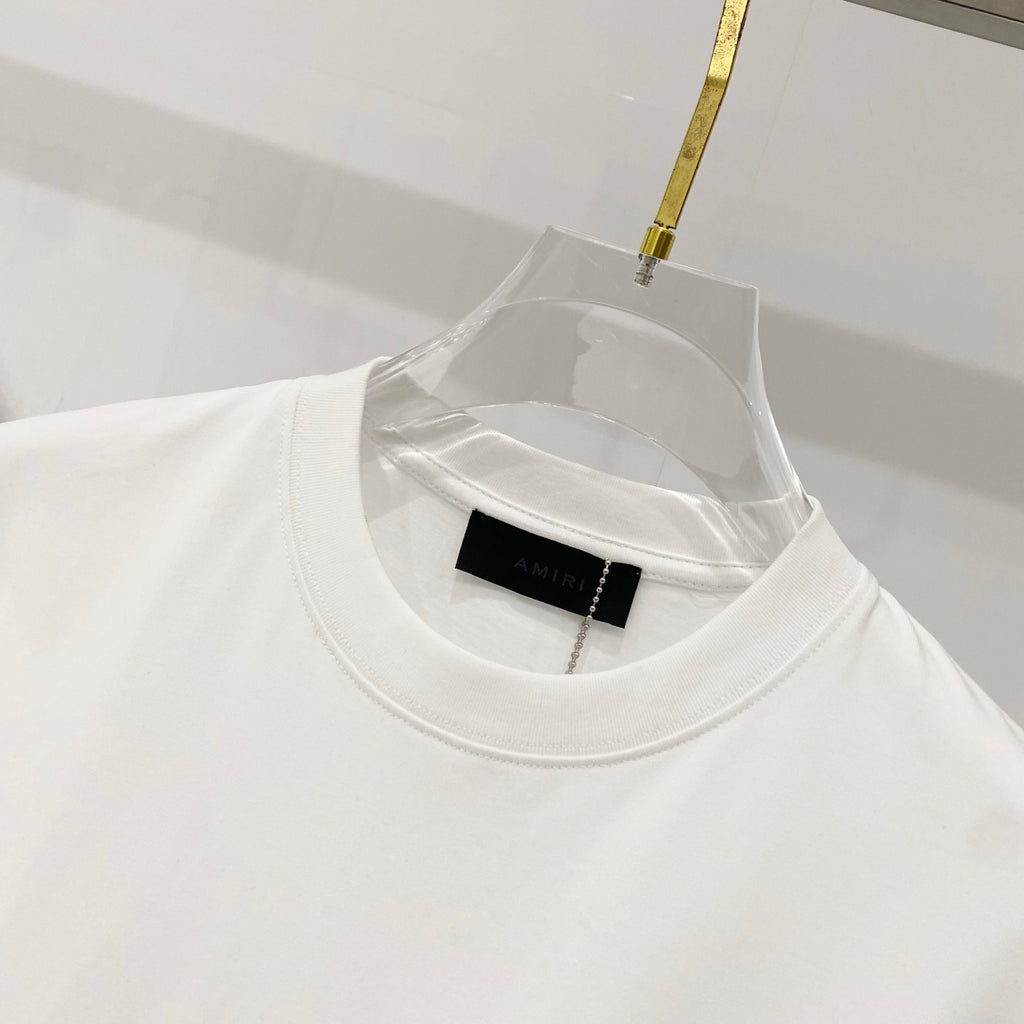 Amiri white T-shirt neckline with black size label inside collar
