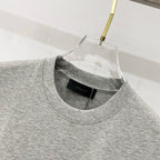 Heather gray Amiri T-shirt crew neck with black brand label at collar