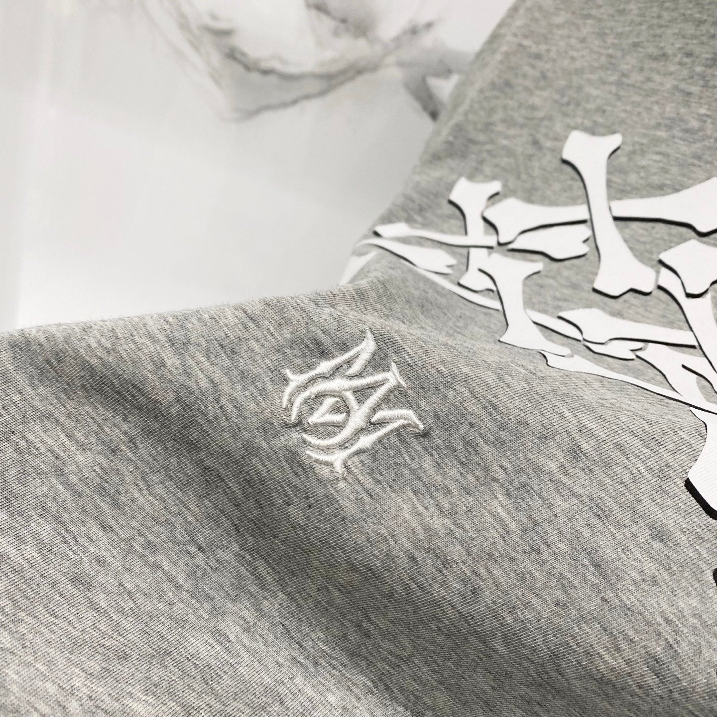 Heather gray Amiri T-shirt with small logo crest on sleeve
