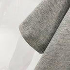 Heather gray Amiri T-shirt sleeve close-up with stitched hem