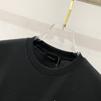 Black crewneck T-shirt with AMIRI logo label at neckline seam