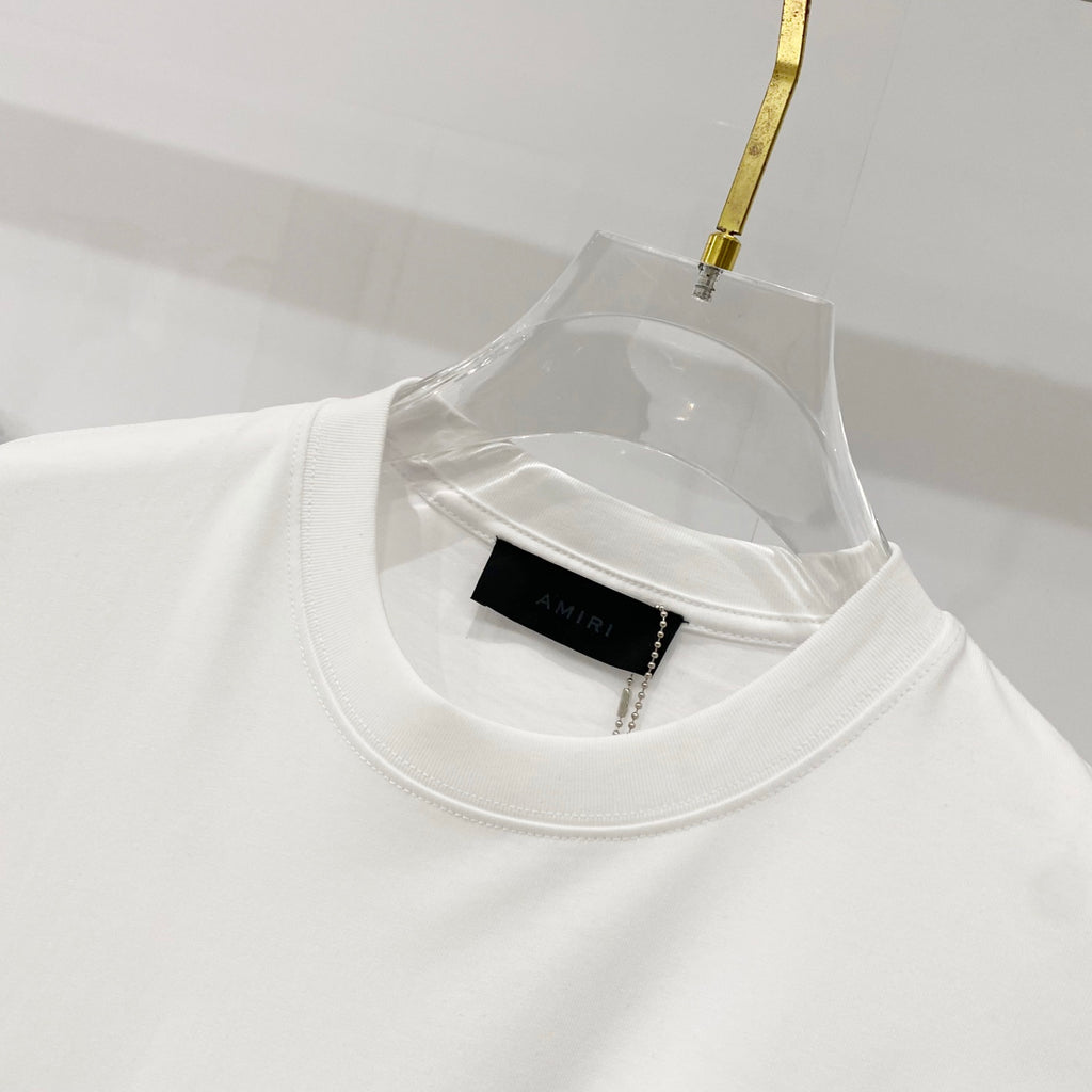 White crewneck T-shirt neck area with black woven label