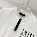 White crewneck T-shirt collar with black tag label and drippy logo graphic