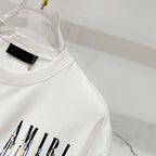 White crewneck T-shirt with AMIRI drip logo print and black neck label