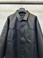 Balenciaga long coat in dark leather-look with chest button front and patch pockets