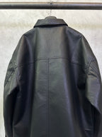 Balenciaga long coat in dark leather-look, back view with shoulder yoke and seams