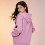 Stone Island pink zip-up hoodie back view with hood and sleeve patch